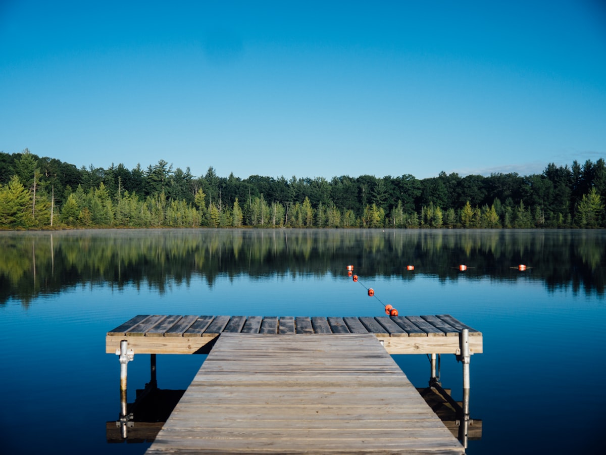 Calm lake dock and clear water