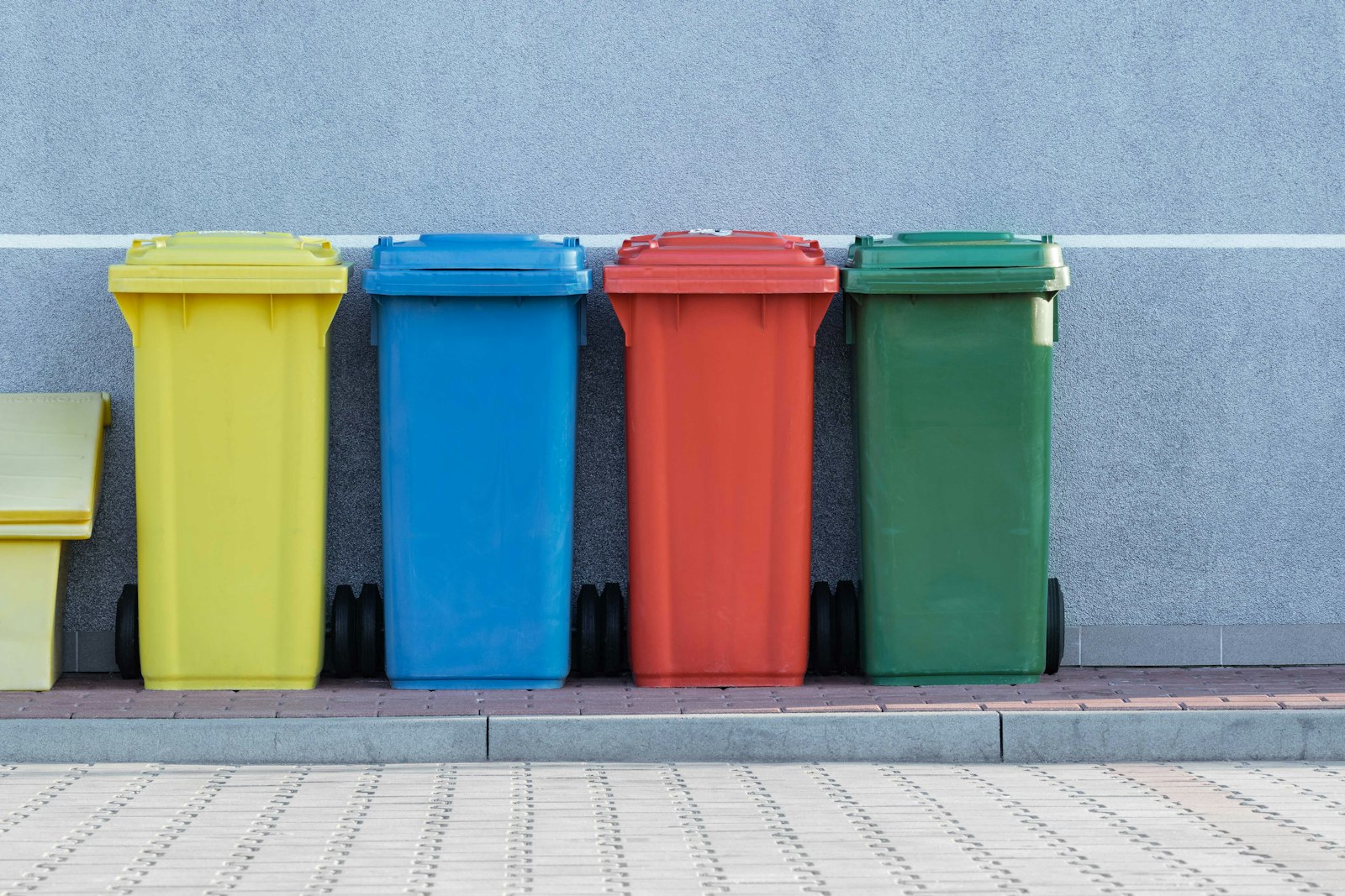 Hands sorting recyclable waste for cleanup